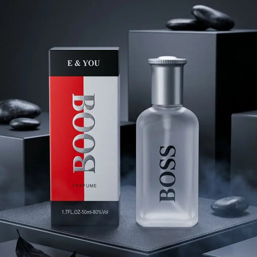 BOSS BOOSTYLE E & YOU perfume bottle and packaging box displayed on a dark gray pedestal with black stones in the background.